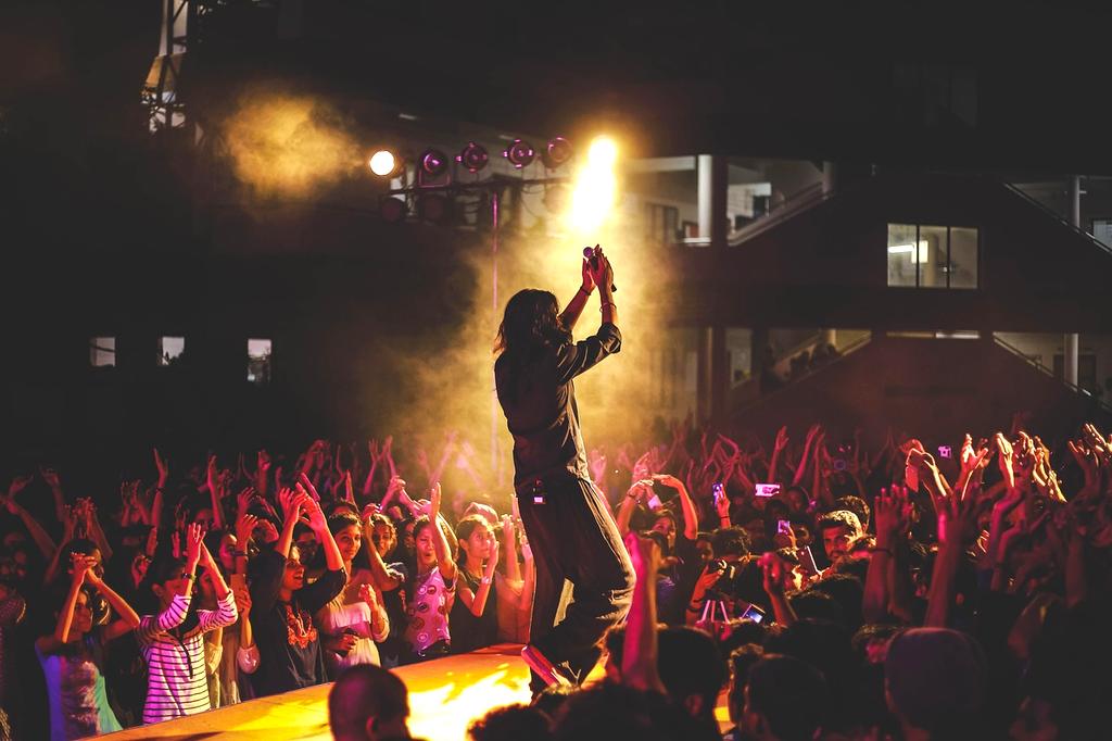 Audience applauding at live concert event