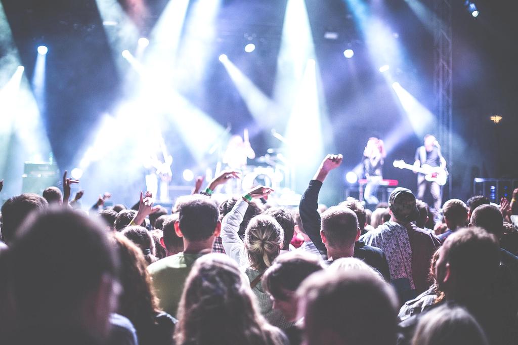 Dynamic entertainment venue with stage lights and audience