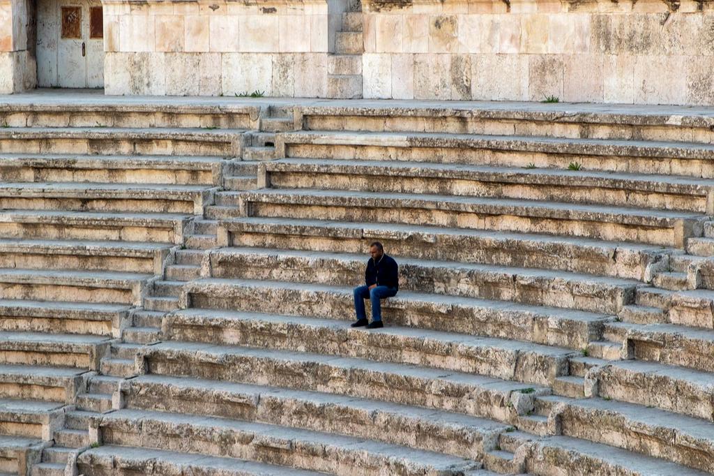Historic theater with ornate balconies and chandelier
